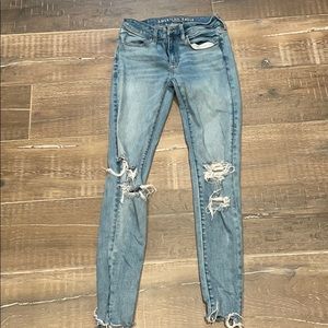 Skinny distressed ankle jeans.